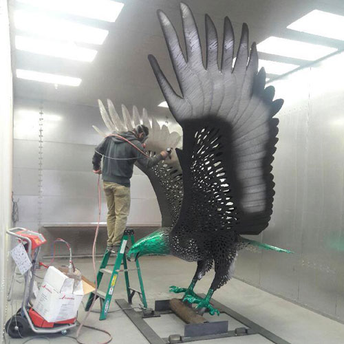 Powder Coating Being Applied to Eagle