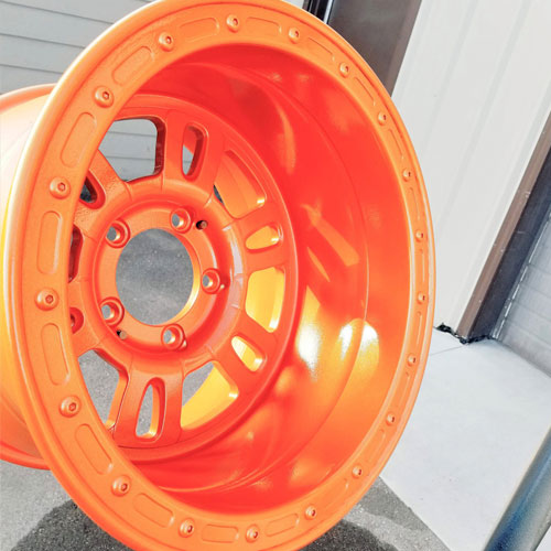 photo of orange powder coated wheel hubs